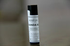 Lip balm tube with label on a blurred background