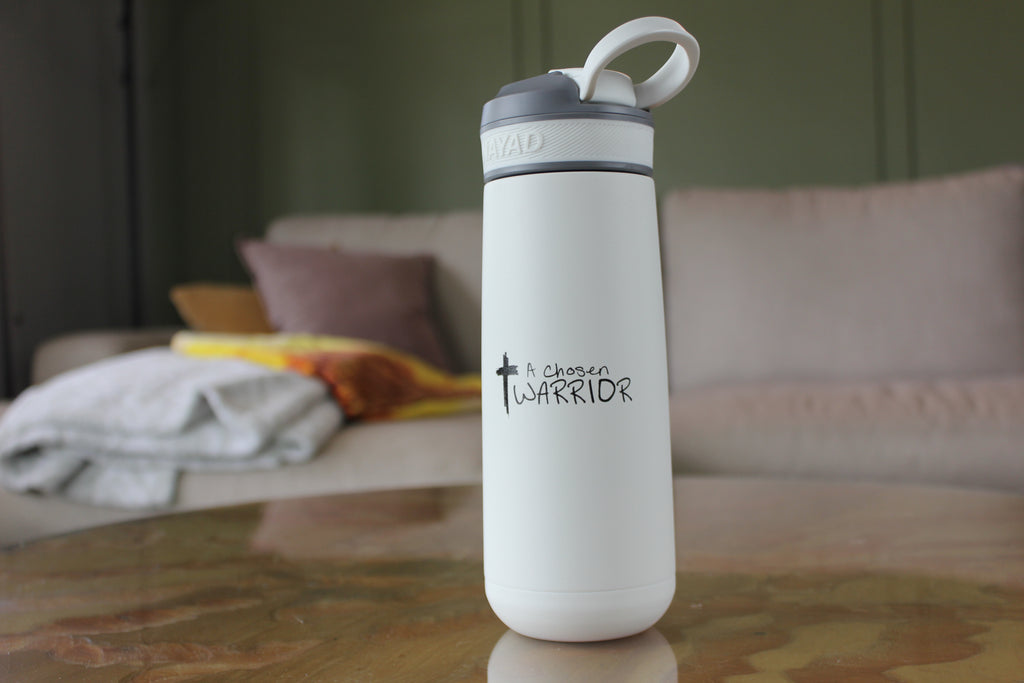 White water bottle with A Chosen Warrior Logo on a wooden table