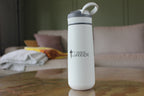 White water bottle with A Chosen Warrior Logo on a wooden table